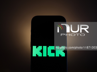 Kick logo displayed on a phone screen is seen in this illustration photo taken in Poland on December 15, 2024. (