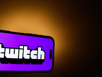 Twitch logo displayed on a phone screen is seen in this illustration photo taken in Poland on December 15, 2024. (