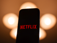 Netflix logo displayed on a phone screen is seen in this illustration photo taken in Poland on December 15, 2024. (