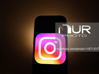 Instagram logo displayed on a phone screen is seen in this illustration photo taken in Poland on December 15, 2024. (