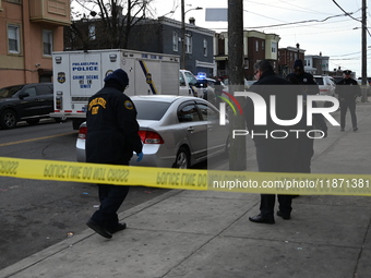 Philadelphia Police crime scene unit investigators are at the scene where one person is killed and four other people are injured in a mass s...