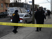 Philadelphia Police crime scene unit investigators are at the scene where one person is killed and four other people are injured in a mass s...