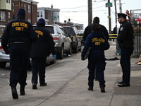 Philadelphia Police crime scene unit investigators are at the scene where one person is killed and four other people are injured in a mass s...