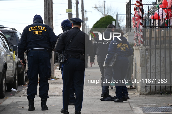 Philadelphia Police crime scene unit investigators are at the scene where one person is killed and four other people are injured in a mass s...