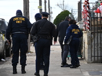 Philadelphia Police crime scene unit investigators are at the scene where one person is killed and four other people are injured in a mass s...