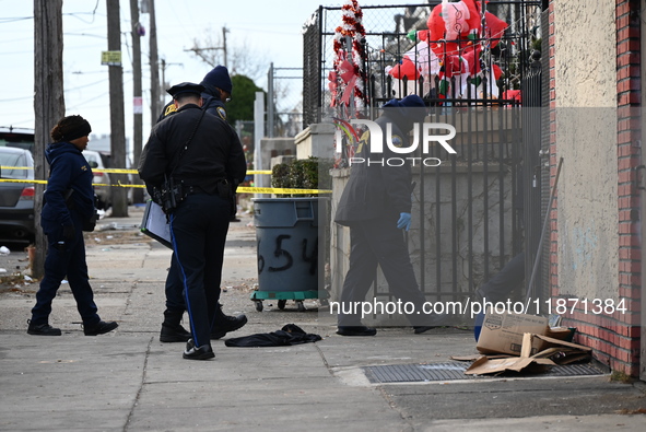 Philadelphia Police crime scene unit investigators are at the scene where one person is killed and four other people are injured in a mass s...