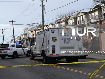 Philadelphia Police crime scene unit investigators are at the scene where one person is killed and four other people are injured in a mass s...