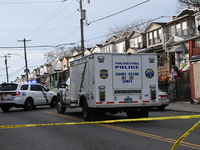 Philadelphia Police crime scene unit investigators are at the scene where one person is killed and four other people are injured in a mass s...