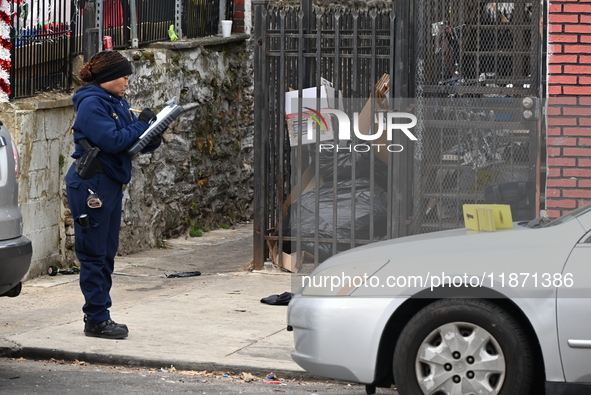 Philadelphia Police crime scene unit investigators are at the scene where one person is killed and four other people are injured in a mass s...