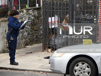 Philadelphia Police crime scene unit investigators are at the scene where one person is killed and four other people are injured in a mass s...