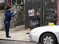 Philadelphia Police crime scene unit investigators are at the scene where one person is killed and four other people are injured in a mass s...