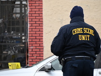 Philadelphia Police crime scene unit investigators are at the scene where one person is killed and four other people are injured in a mass s...