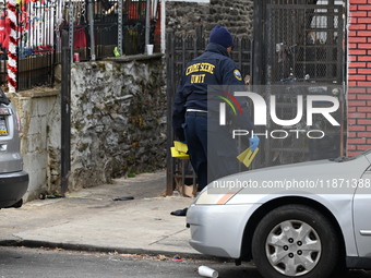 Philadelphia Police crime scene unit investigators are at the scene where one person is killed and four other people are injured in a mass s...