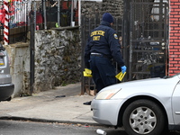 Philadelphia Police crime scene unit investigators are at the scene where one person is killed and four other people are injured in a mass s...