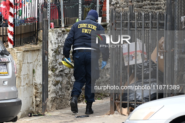 Philadelphia Police crime scene unit investigators are at the scene where one person is killed and four other people are injured in a mass s...