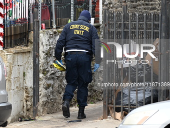 Philadelphia Police crime scene unit investigators are at the scene where one person is killed and four other people are injured in a mass s...