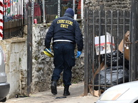 Philadelphia Police crime scene unit investigators are at the scene where one person is killed and four other people are injured in a mass s...