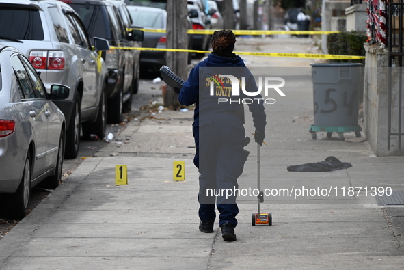 Philadelphia Police crime scene unit investigators are at the scene where one person is killed and four other people are injured in a mass s...