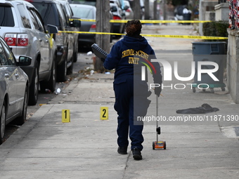 Philadelphia Police crime scene unit investigators are at the scene where one person is killed and four other people are injured in a mass s...