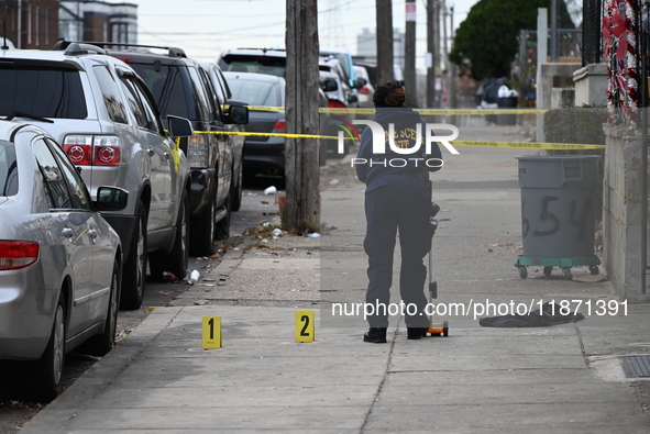 Philadelphia Police crime scene unit investigators are at the scene where one person is killed and four other people are injured in a mass s...