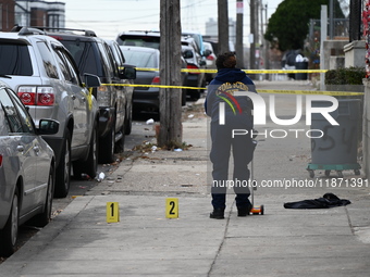 Philadelphia Police crime scene unit investigators are at the scene where one person is killed and four other people are injured in a mass s...