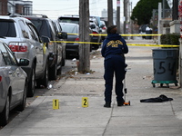 Philadelphia Police crime scene unit investigators are at the scene where one person is killed and four other people are injured in a mass s...