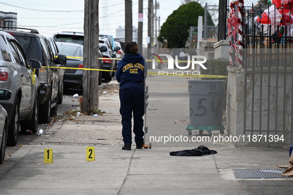 Philadelphia Police crime scene unit investigators are at the scene where one person is killed and four other people are injured in a mass s...