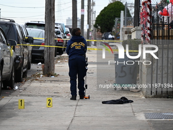 Philadelphia Police crime scene unit investigators are at the scene where one person is killed and four other people are injured in a mass s...