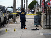 Philadelphia Police crime scene unit investigators are at the scene where one person is killed and four other people are injured in a mass s...