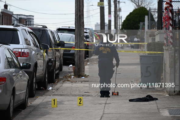 Philadelphia Police crime scene unit investigators are at the scene where one person is killed and four other people are injured in a mass s...