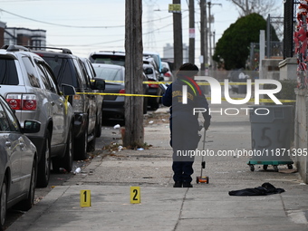 Philadelphia Police crime scene unit investigators are at the scene where one person is killed and four other people are injured in a mass s...