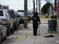 Philadelphia Police crime scene unit investigators are at the scene where one person is killed and four other people are injured in a mass s...