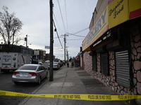 Philadelphia Police crime scene unit investigators are at the scene where one person is killed and four other people are injured in a mass s...