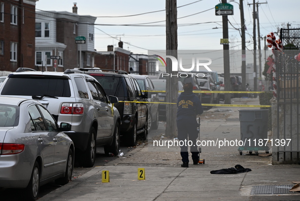 Philadelphia Police crime scene unit investigators are at the scene where one person is killed and four other people are injured in a mass s...