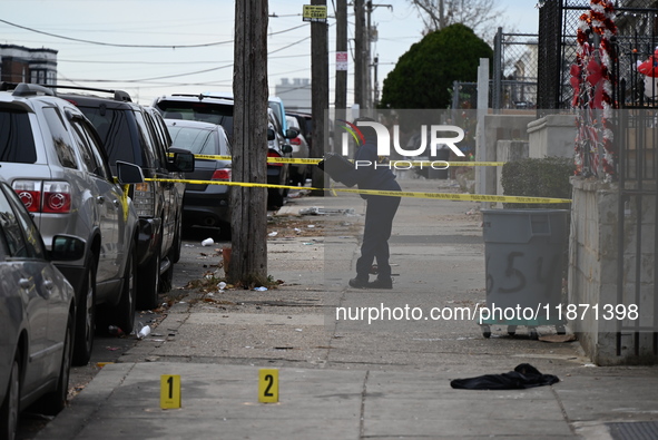 Philadelphia Police crime scene unit investigators are at the scene where one person is killed and four other people are injured in a mass s...