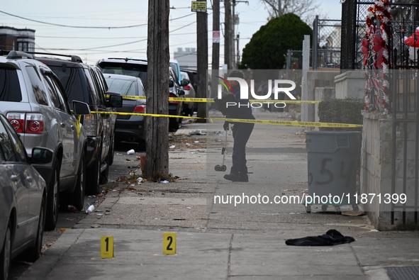 Philadelphia Police crime scene unit investigators are at the scene where one person is killed and four other people are injured in a mass s...