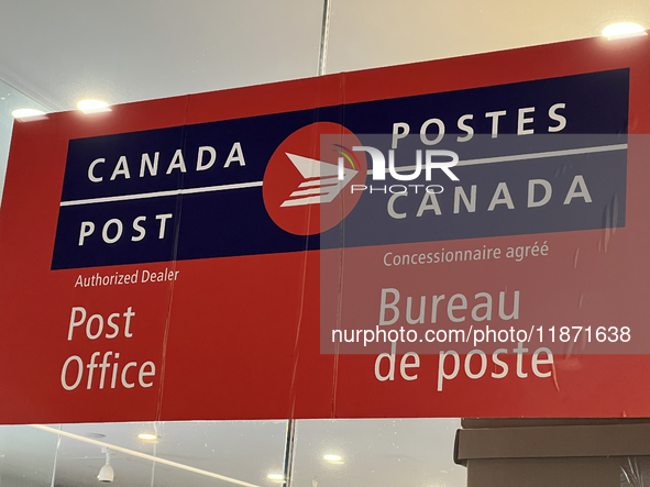 A Canada Post sign is seen in Toronto, Ontario, Canada, on December 15, 2024. Canada Post stops delivering mail across the country as Canada...