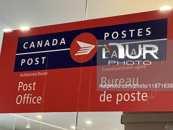 A Canada Post sign is seen in Toronto, Ontario, Canada, on December 15, 2024. Canada Post stops delivering mail across the country as Canada...