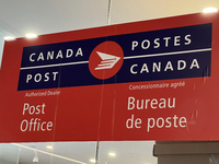 A Canada Post sign is seen in Toronto, Ontario, Canada, on December 15, 2024. Canada Post stops delivering mail across the country as Canada...