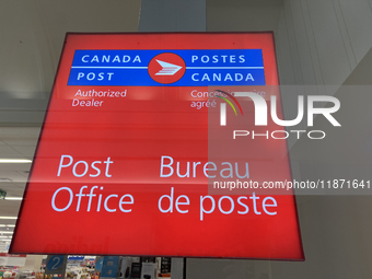 A Canada Post sign is seen in Toronto, Ontario, Canada, on December 15, 2024. Canada Post stops delivering mail across the country as Canada...