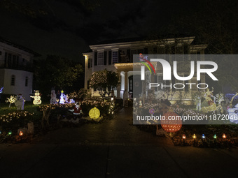 Houses and their gardens in the Celebration region in Florida are decorated with the Christmas theme on October 13. (