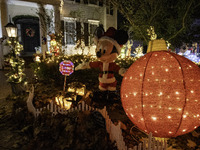 Houses and their gardens in the Celebration region in Florida are decorated with the Christmas theme on October 13. (