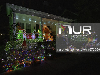 Houses and their gardens in the Celebration region in Florida are decorated with the Christmas theme on October 13. (