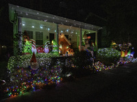 Houses and their gardens in the Celebration region in Florida are decorated with the Christmas theme on October 13. (