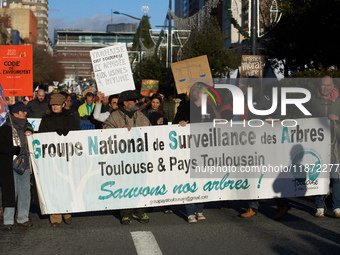 The banner of the GNSA is displayed during the protest. Between 100 and 1500 people gather in Toulouse, France, on December 15, 2024, agains...