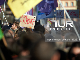 Amid the crowd, a placard reads 'Shame on the A69'. Between 100 and 1500 people gather in Toulouse, France, on December 15, 2024, against a...