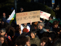 A protester holds a placard reading 'Atosca and State the law is not for them'. Between 100 and 1500 people gather in Toulouse, France, on D...