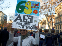 A protester holds a cardboard sign against the A69. Between 100 and 1500 people gather in Toulouse, France, on December 15, 2024, against a...