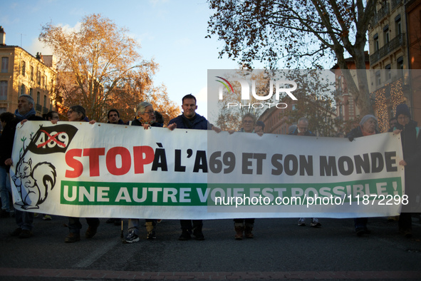 The banner reads 'Stop to the A69 and its world, another way is possible'. Between 1,000 and 1,500 people gather in Toulouse, France, on Dec...