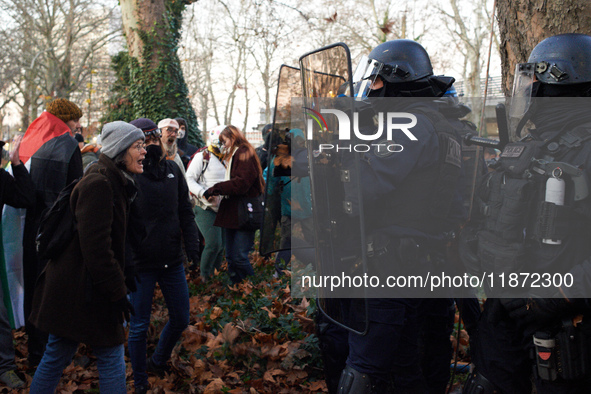 A woman shouts at riot policemen near the Administrative Court of Toulouse. Between 1,000 and 1,500 people gather in Toulouse, France, on De...